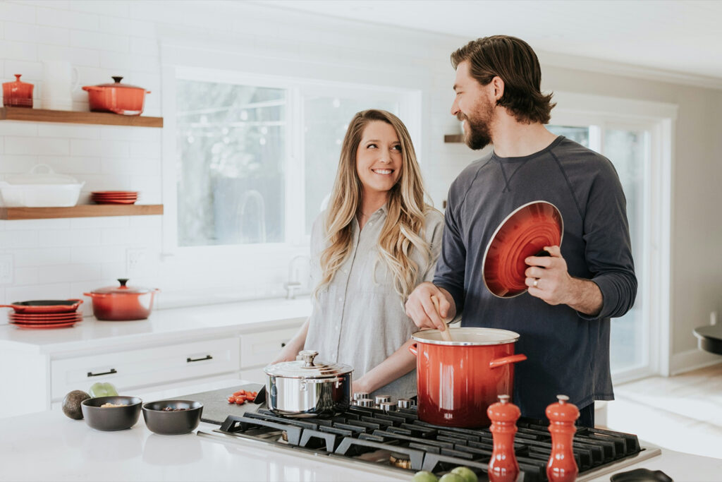 Family enjoying making dinner in a new home built by Cornel Construction